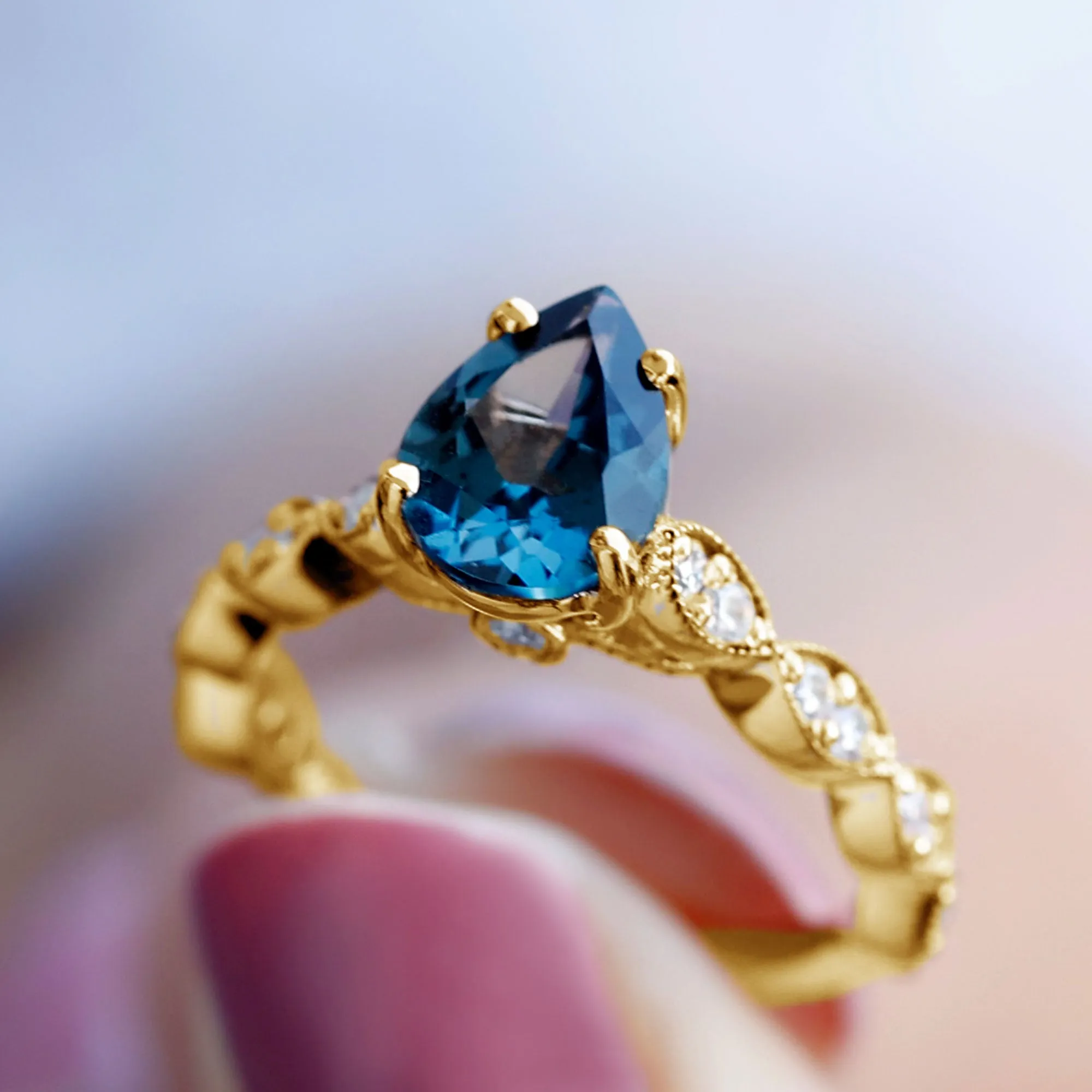 1.25 CT Teardrop London Blue Topaz Solitaire Ring with Diamond