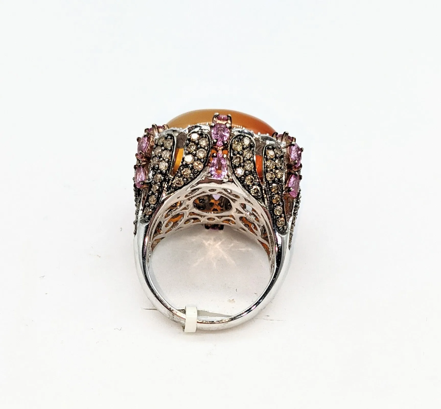 14 karat white gold with 1.65 carat total weight in diamonds pale orange ombre cabachon stone ring