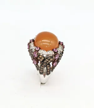 14 karat white gold with 1.65 carat total weight in diamonds pale orange ombre cabachon stone ring