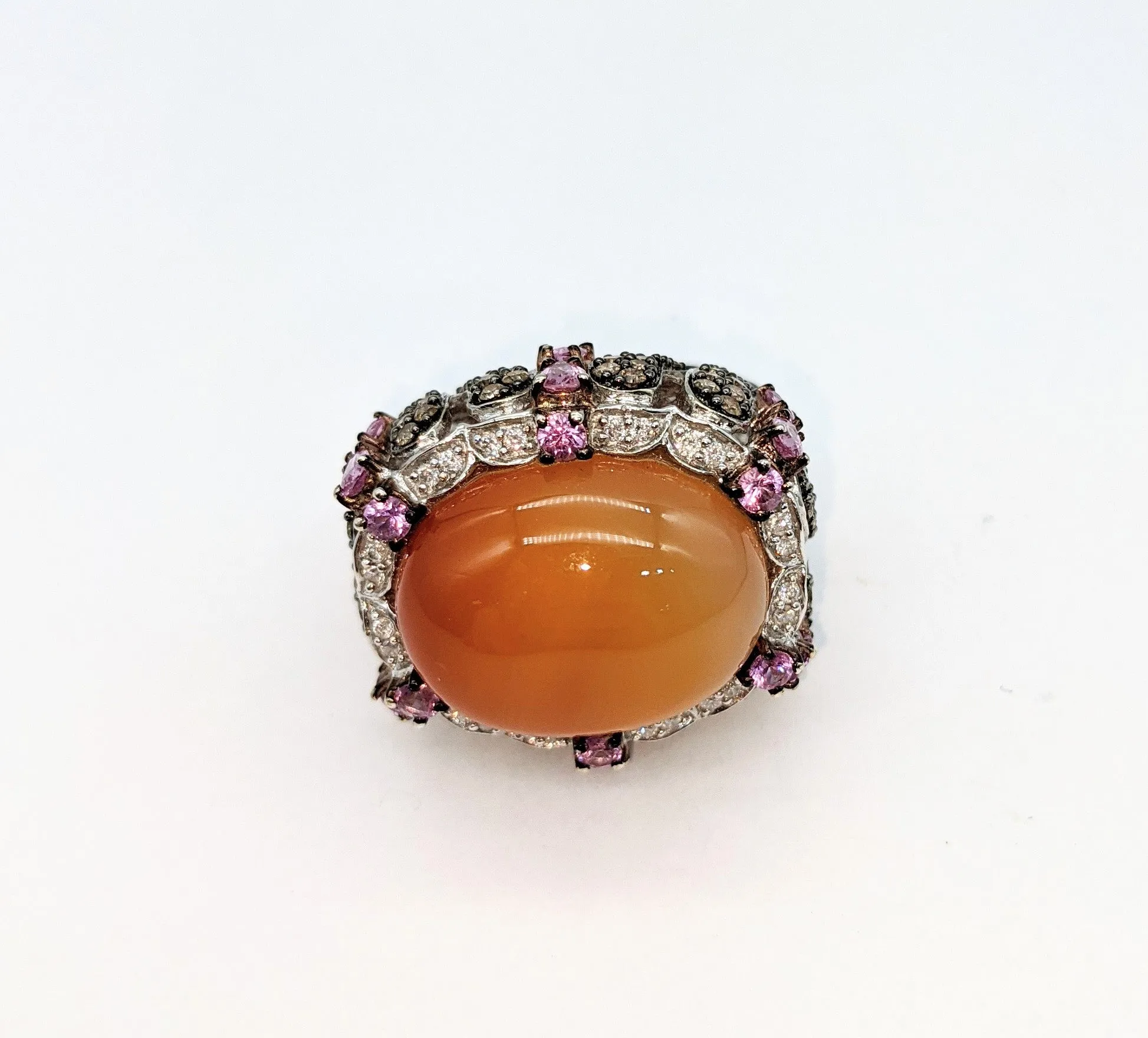 14 karat white gold with 1.65 carat total weight in diamonds pale orange ombre cabachon stone ring