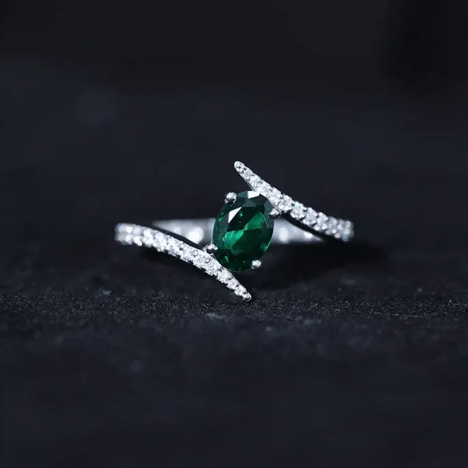 Oval Shape Lab Grown Emerald Solitaire Bypass Ring with Moissanite